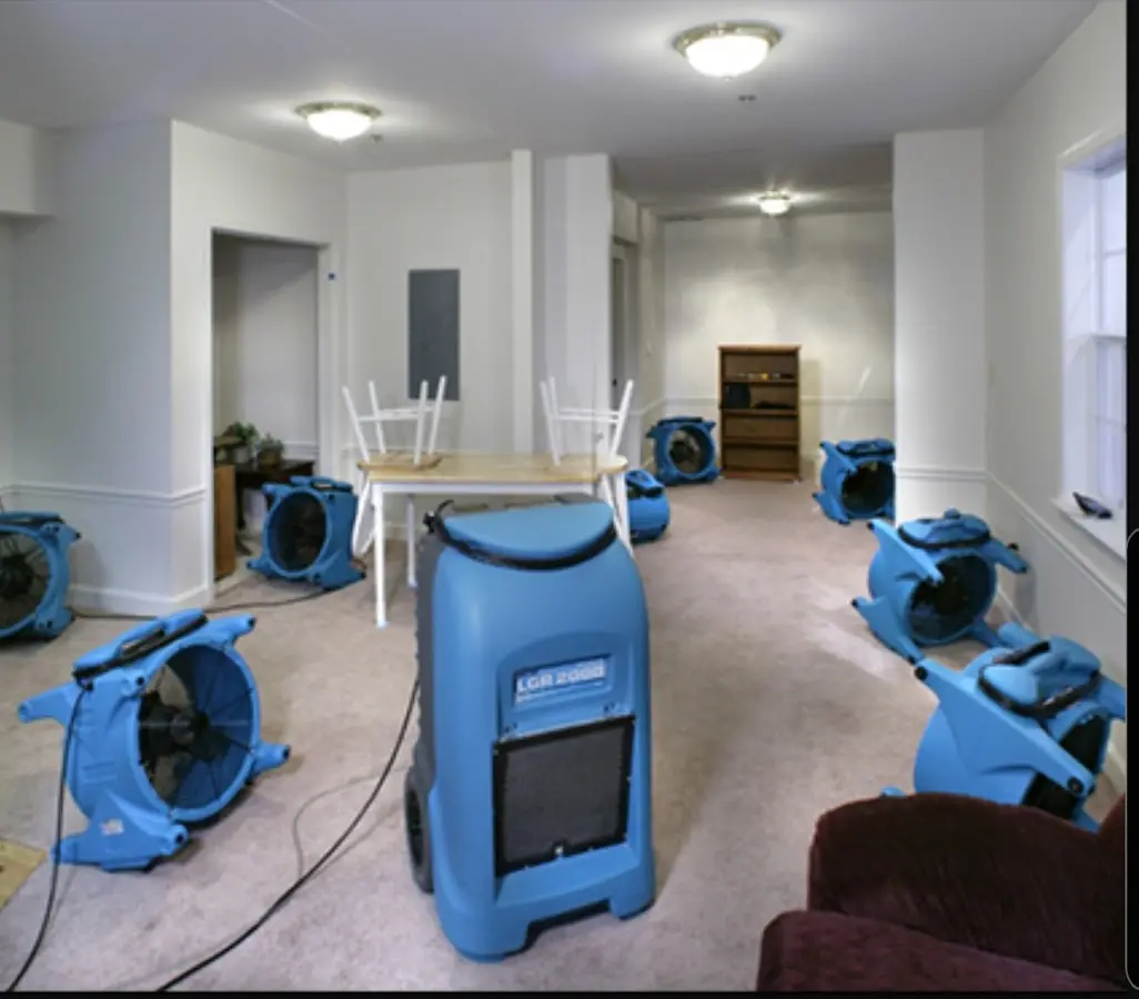 Air movers and dehumidifier setup for Water Damage Restoration in Olivette